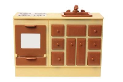 Le nouveau jouet cool pour les enfants en 1963 était l'Easy-Bake Oven, un four de travail jouet moyenne avec une cuisinière faux qui est venu avec un gâteau mêle à cuire au four à des températures très basses